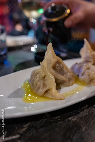 Steamed Japanese gyoza dumplings with beef filling served with soy vinegar souse in Japan restaurant