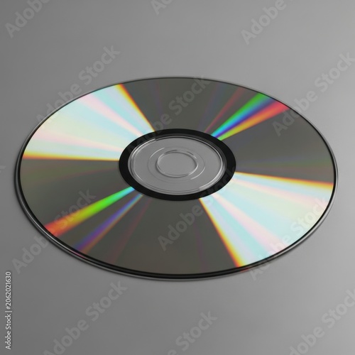 Compact Disc Reflecting Rainbow Colors on Gray Background.