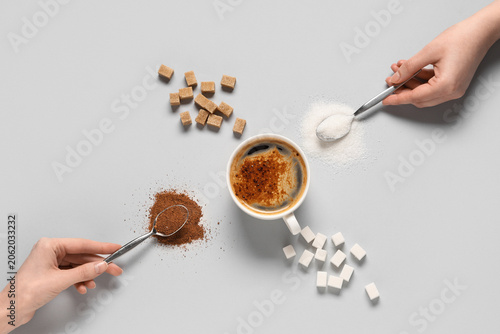 Female hands with spoons of...