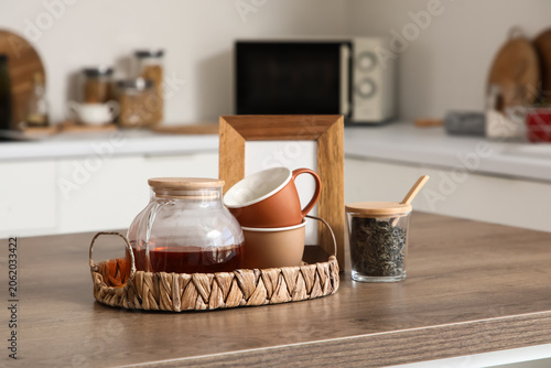 Tray with glass teapot and ...
