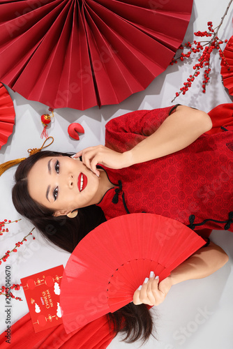 Young Asian woman with chin...