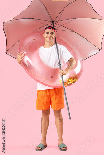Happy young man with inflat...