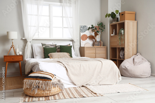 Interior of light bedroom w...