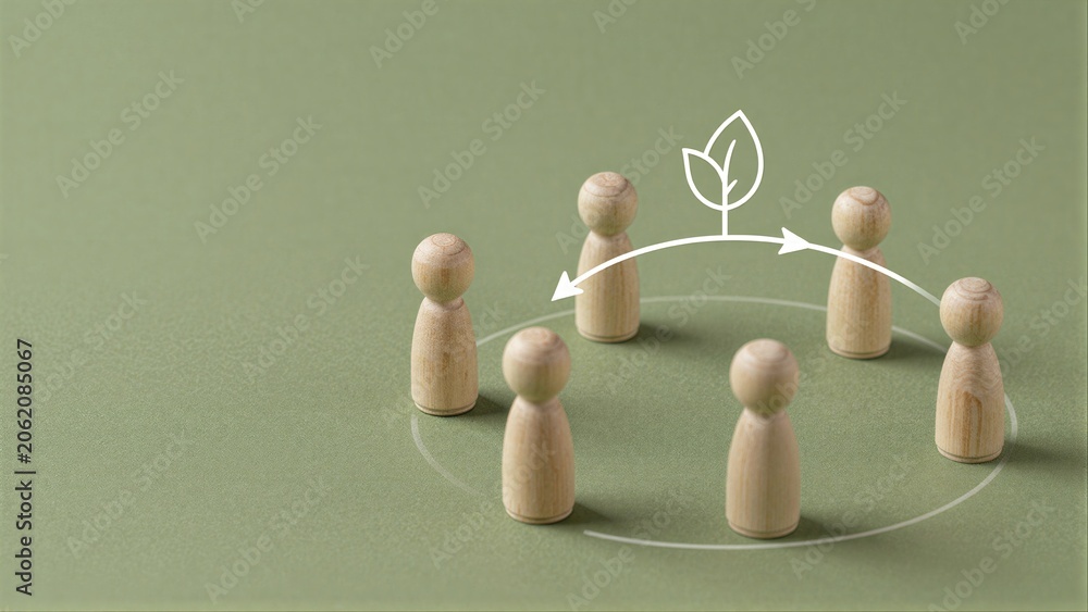 Obraz premium Four wooden figures in a circle, with leaf symbol above them.