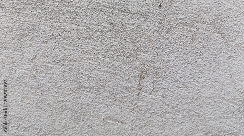 Grungy white concrete wall texture, weathered cement surface background, industrial stone plaster finish for architectural design and overlays