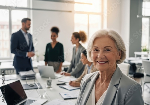 Professional businesswoman smiling in a modern office with colleagues working in the background
