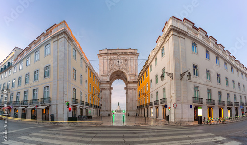 Rua Augusta Arch viewed at dawn from the entrance to Commerce Square in central Lisbon, Portugal.