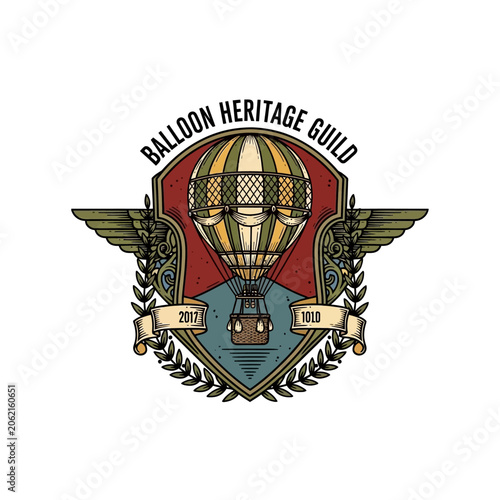 Obraz na plátně Balloon heritage guild emblem featuring hot air balloon and wings
