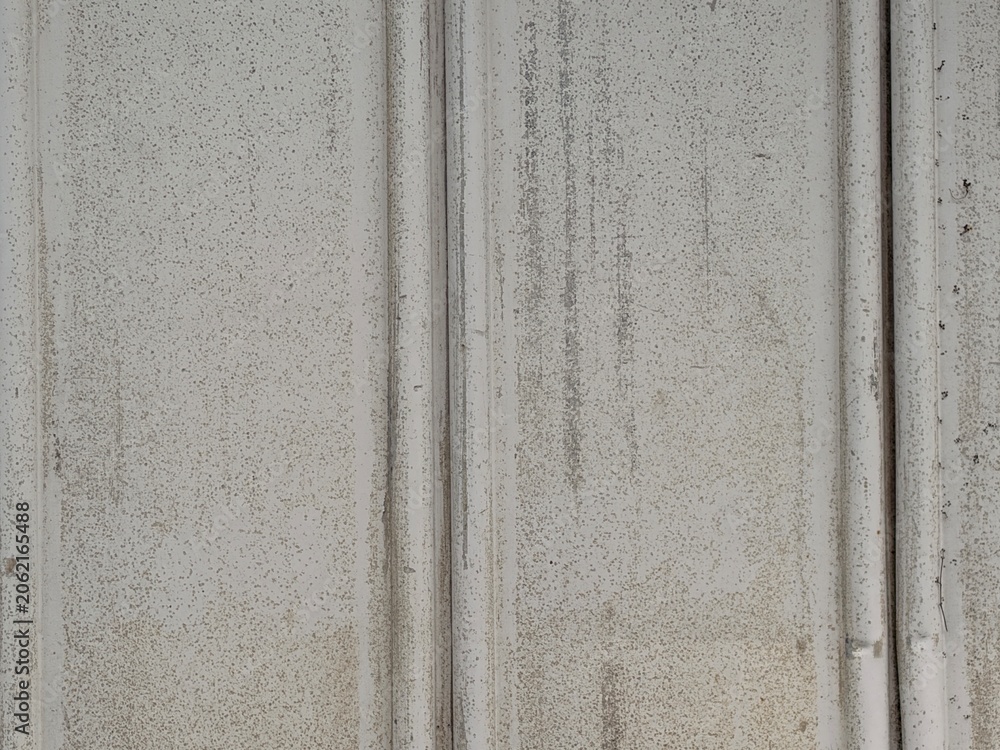 Fototapeta premium Weathered white vertical textured industrial wall background in Sapporo