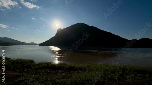 Golden sunset over Mekong River and mountains in Chiang Khan, Thailand