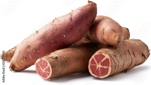 Pile of purple skinned root vegetables featuring one piece sliced to reveal bright interior flesh.