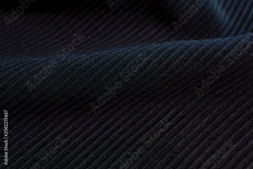 Black ribbed fabric texture close up