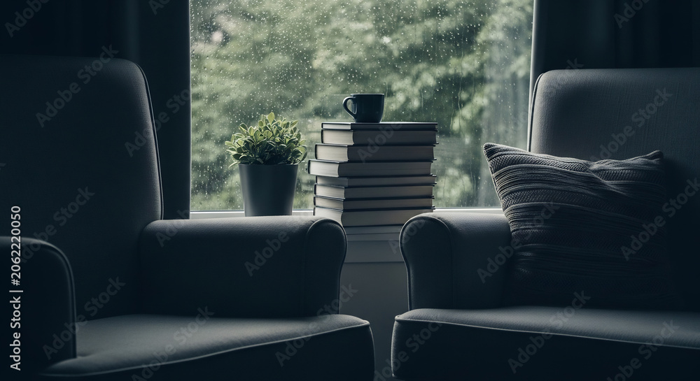 Obraz premium Cozy Reading Nook with View of Spring Rain and Blossoms