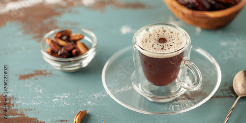 Bild auf Leinwand Cup with dates coffee  with date seeds