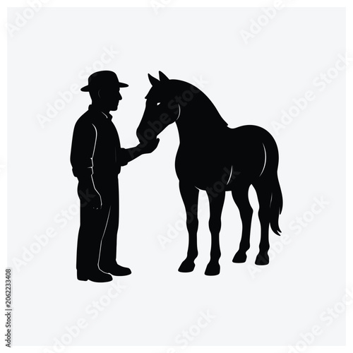 Silhouette of a man petting a standing horse.