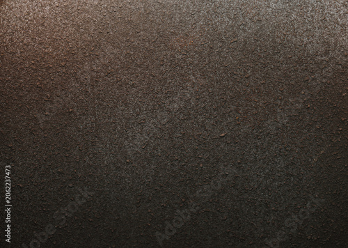 The cement walls are rough and uneven, with a blackish-gray powdery finish.