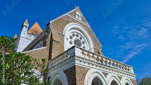 Fotografie ​Low angle view of historic church building facade against clear blue sky