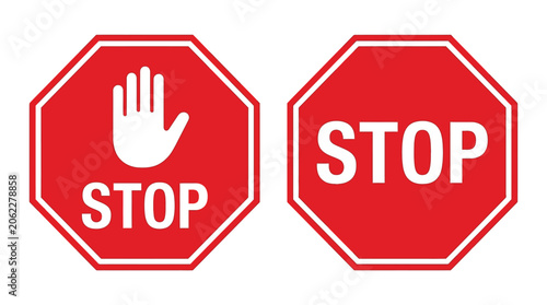 Two bright red octagonal traffic stop signs featuring white text and a palm hand graphic