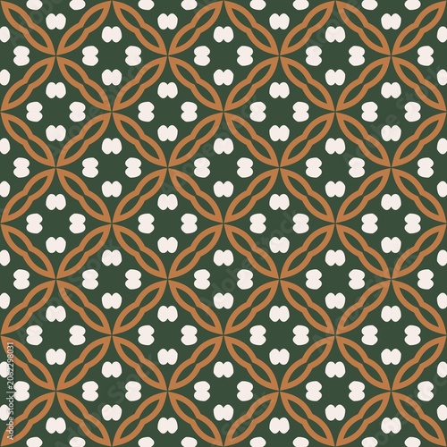 A green and brown patterned fabric with white dots. The pattern is made up of squares and circles