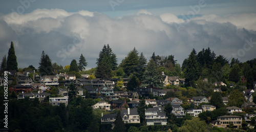 Hillside Neighborhood Beneath Dramatic Pacific Northwest Clouds
