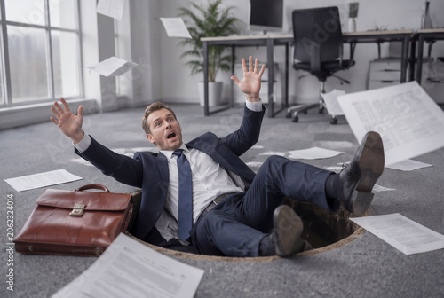 Businessman Falling Into Unexpected Pitfall in Modern Office