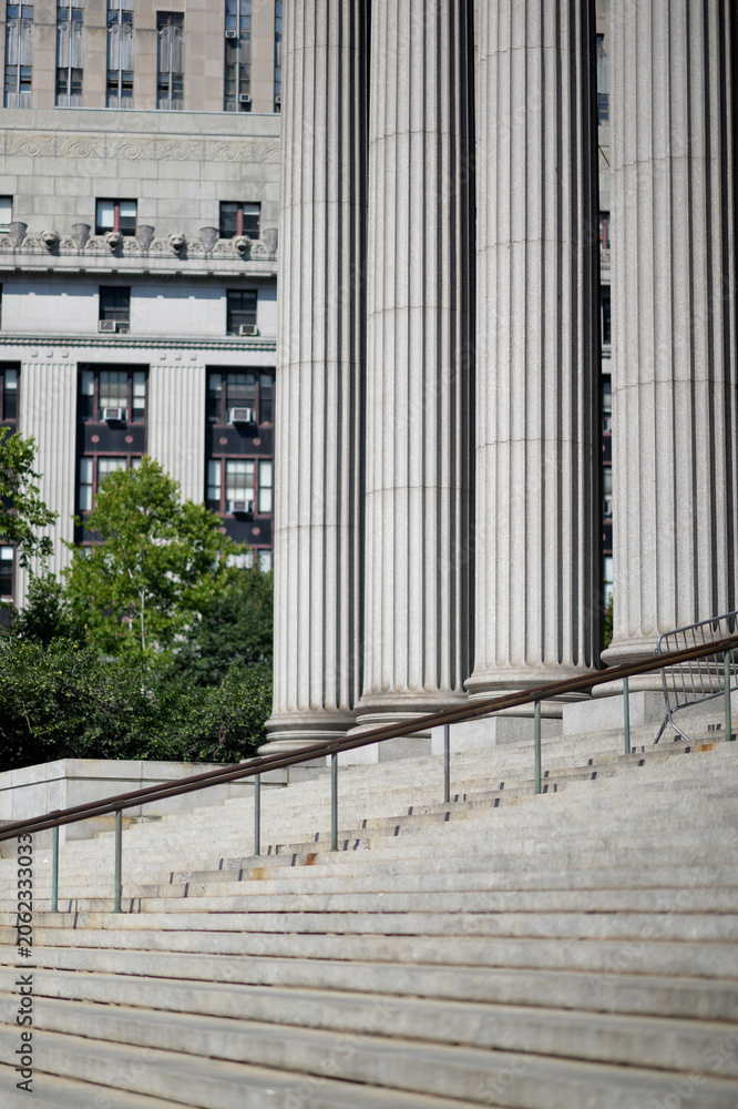 Naklejka premium Stone stairs and tall columns outside a neoclassical building
