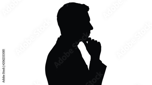 Silhouette of a man in profile with his hand on his chin, deep in thought