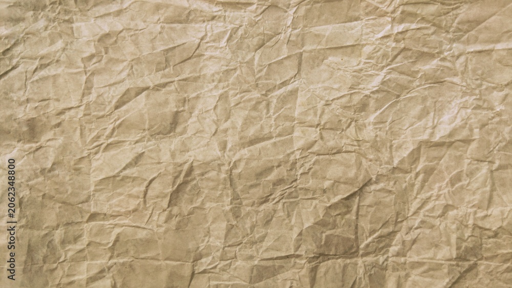 Fototapeta premium Crumpled brown kraft paper texture background