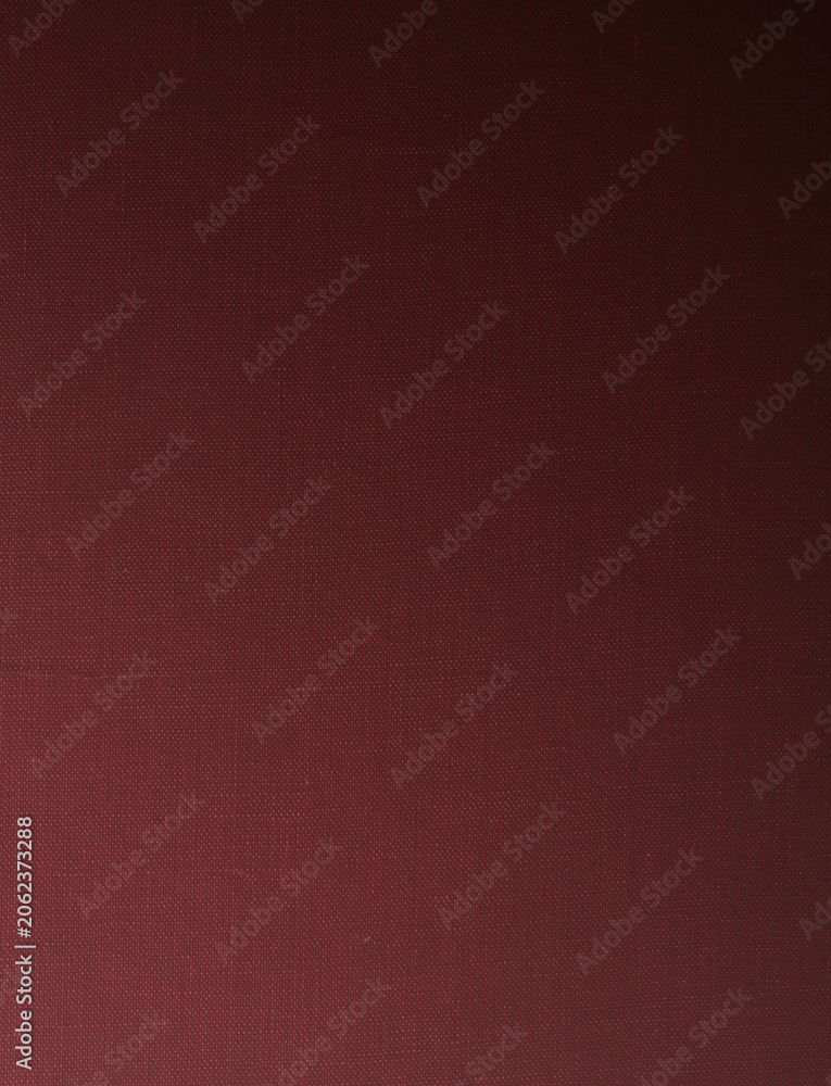 Fototapeta premium Dark maroon canvas texture background with premium fine fabric linen pattern and moody lighting gradient