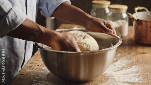 Hands Kneading Dough in Bright Home Kitchen Scene