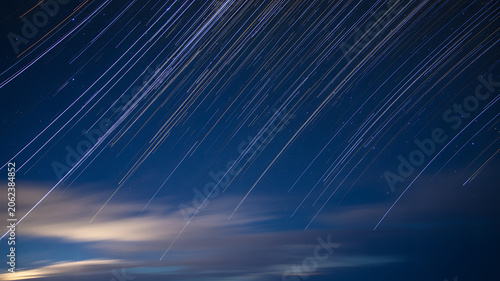 Abstract blue sky with clouds and light rays in futuristic blue wave pattern background design