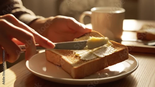 Toast Spreading Butter in Quiet Morning Kitchen Setting