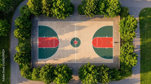 Aerial Top View of Outdoor Basketball Court Surrounded by Green Trees in Urban Park