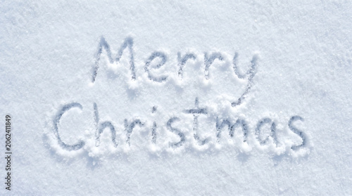 Merry Christmas Message Written in Fresh Snow Background