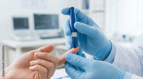 Female Nurse Measuring Patient Blood Sugar Level, Medical Diagnostics