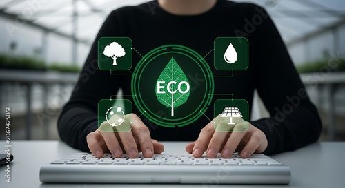 Person typing on keyboard with holographic eco icons for sustainability