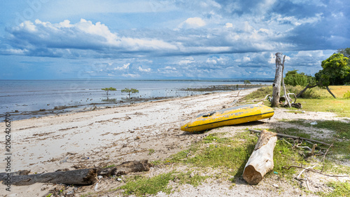Konstfotografi On the white sandy beach, the sea water is receding, and the tranquil surroundin