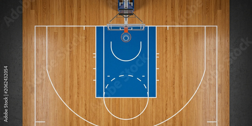 Overhead view of a blue basketball court with white lines on a wooden floor, showcasing a typical court layout with key markings and zones.