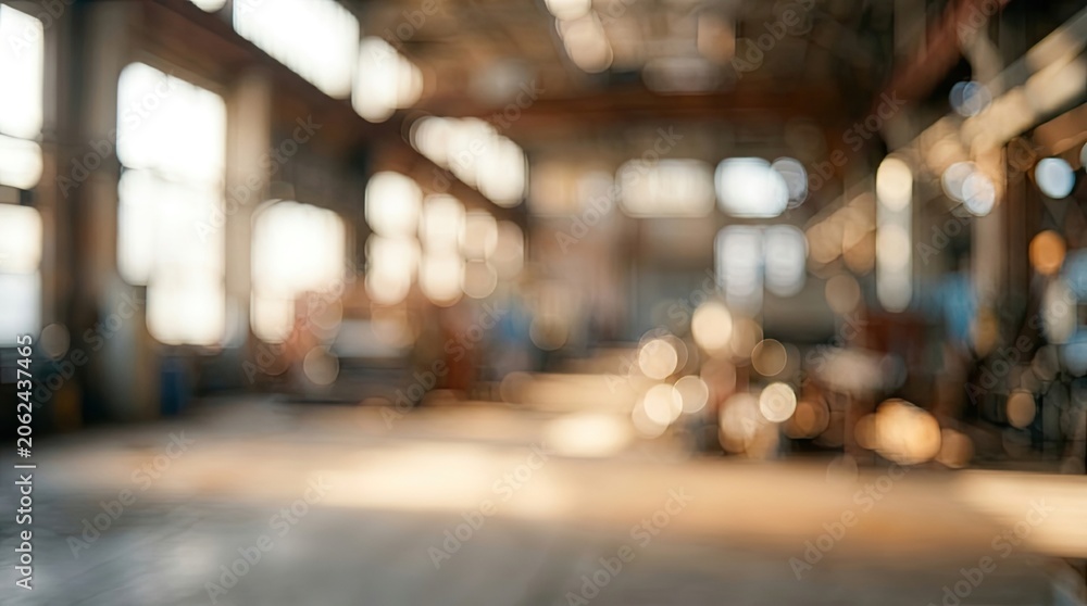 Fototapeta premium Blurry Industrial Warehouse Interior with Natural Light.