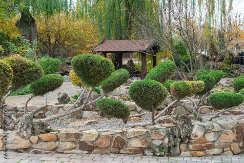 Garden with trimmed bushes and a gazebo area