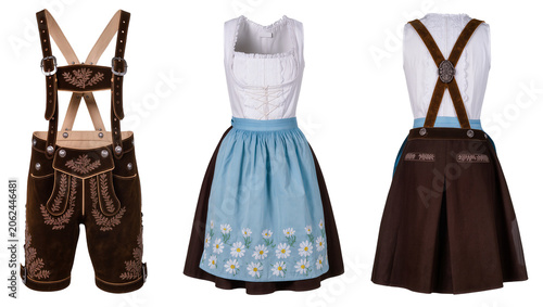 Schilderij op canvas Traditional Bavarian Lederhosen and Dirndl Dress Outfits