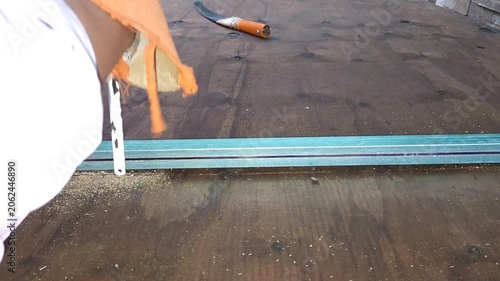 Inserting Hand Fretsaw Blade Into Plywood Sheet Mid-Section to Cut