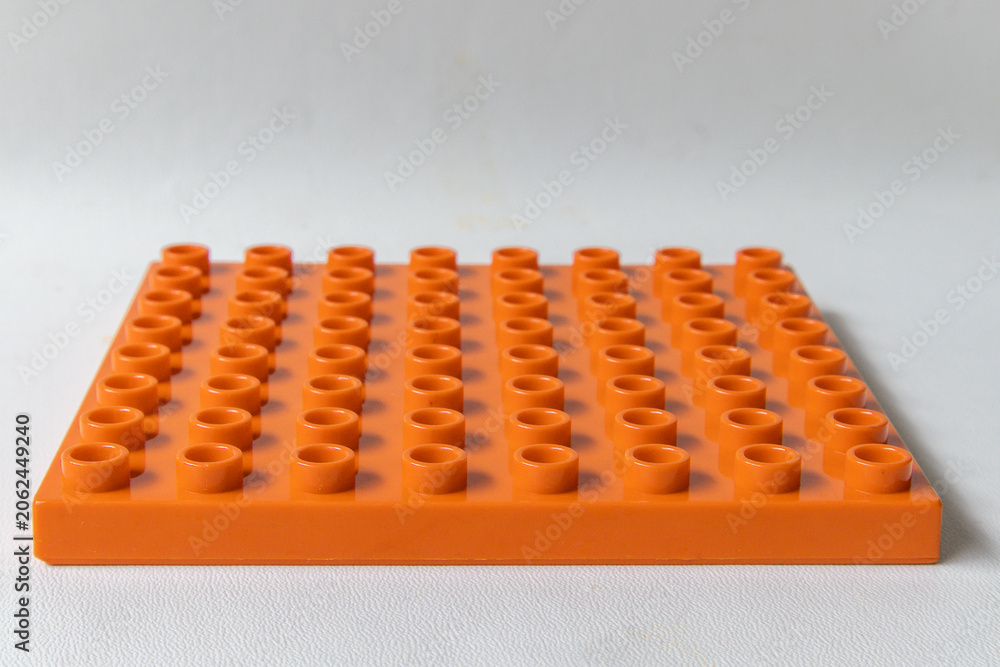 Fototapeta premium Front Perspective view Orange Square lego duplo base plate toy block brick isolated on white
