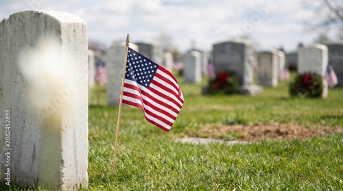 American Flag Atop Grave In Cemetery Memorial Day Remembrance