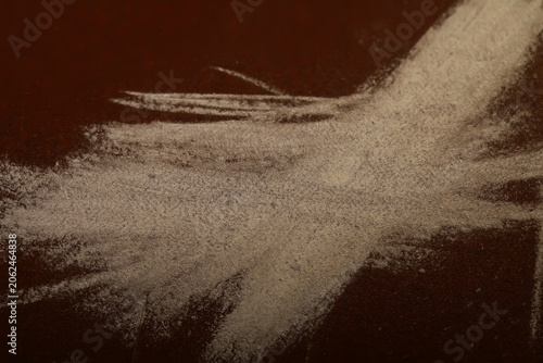 фотографія Abstract Flour Explosion on Rust-Colored Surface Capturing Dynamic Motion and Te
