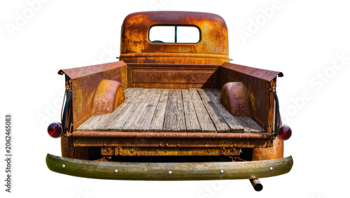 Rusty vintage pickup truck rear view with wooden bed