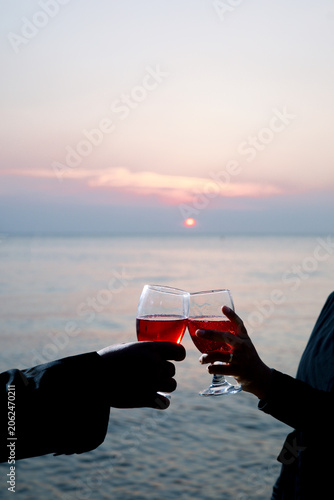 cheers with a beach view