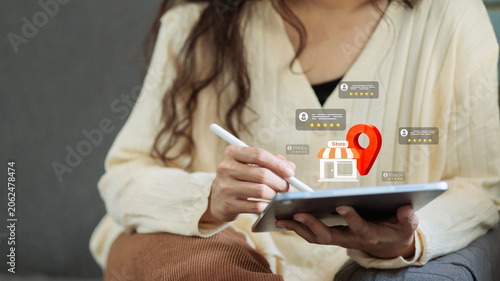 Photos Woman Using Tablet for Local Store Location Search and Five Star Customer Review