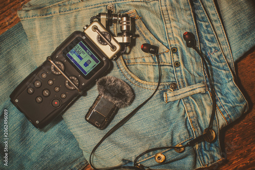 Professional Audio Recorder and Reporter Microphones on Denim Background