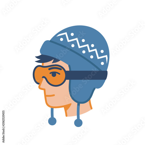 A man wearing a blue winter hat and orange ski goggles